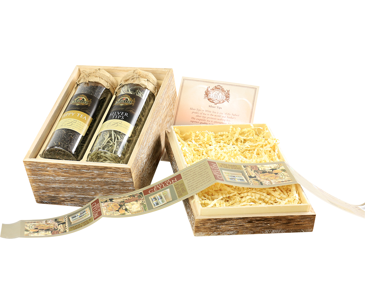 Otwarty zestaw Basilur Silver Tips & Tippy Tea – szklane tuby w ozdobnym drewnianym opakowaniu.