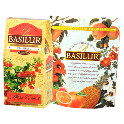 Herbata czarna Basilur Cranberry w opakowaniu prezentowym na tle owocowej grafiki