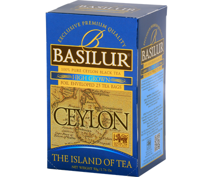 Pudełko herbaty Basilur High Grown z mapą Cejlonu, eleganckie złoto-niebieskie opakowanie.