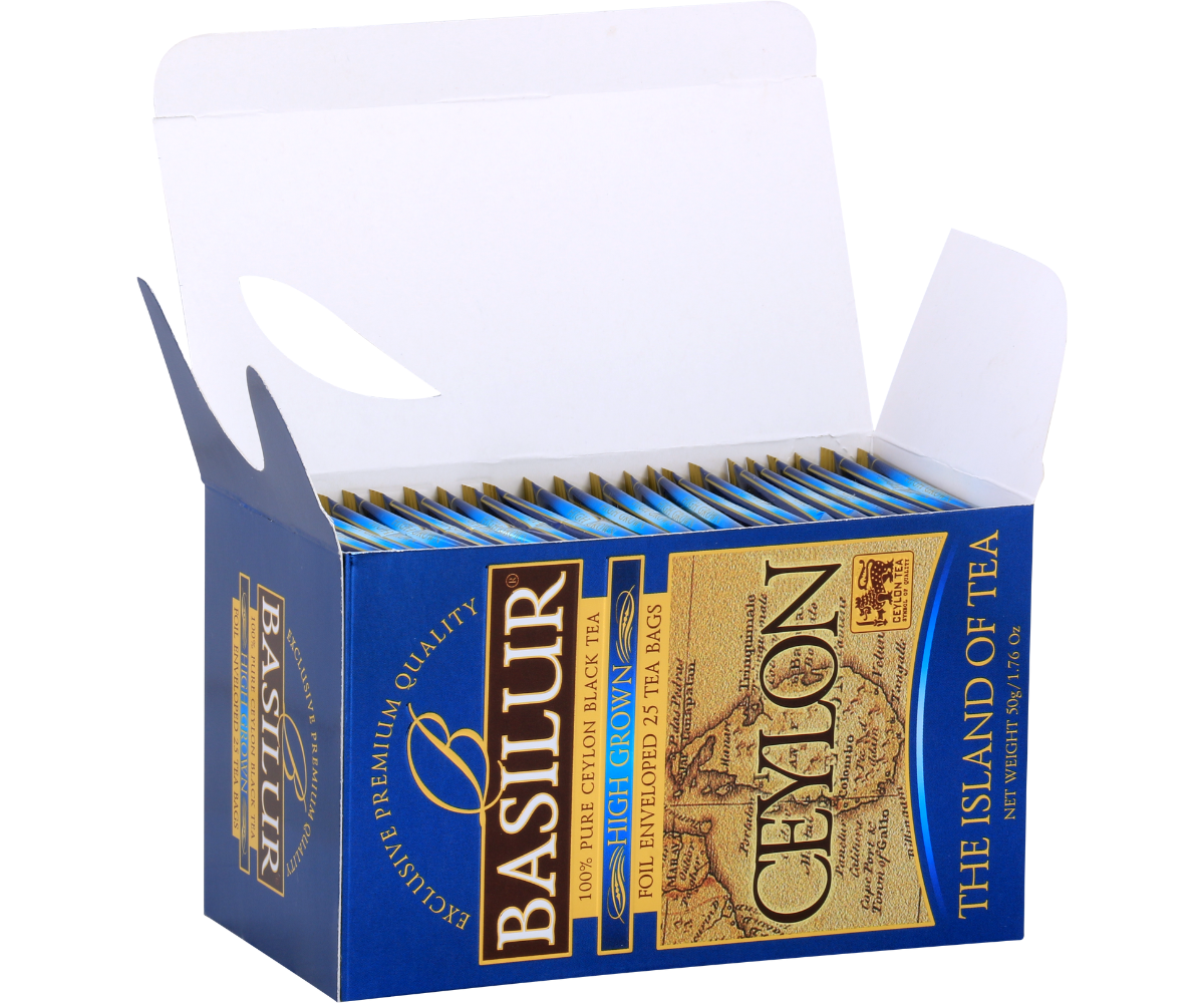 Otwarty kartonik Basilur High Grown z kopertami herbaty, elegancka prezentacja.