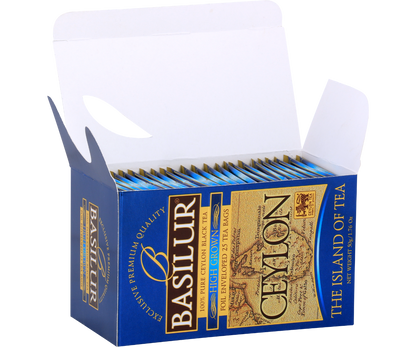 Otwarty kartonik Basilur High Grown z kopertami herbaty, elegancka prezentacja.