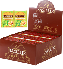 Herbata Basilur Melon & Banana w ekspozytorze typu food service, 100 kopertowanych torebek zielonej herbaty.