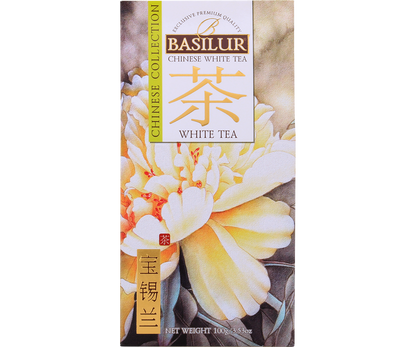 Front opakowania Basilur White Tea z motywem kwiatów w odcieniach kremowo-żółtych.