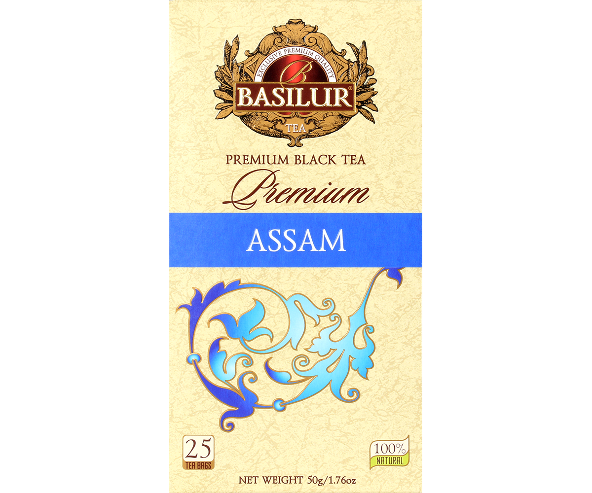 Front pudełka herbaty Basilur Premium Assam z logo i zdobnym motywem roślinnym.
