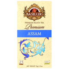 Front pudełka herbaty Basilur Premium Assam z logo i zdobnym motywem roślinnym.