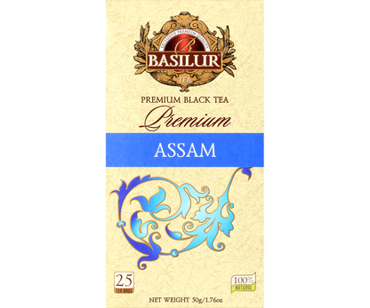 Front pudełka herbaty Basilur Premium Assam z logo i zdobnym motywem roślinnym.