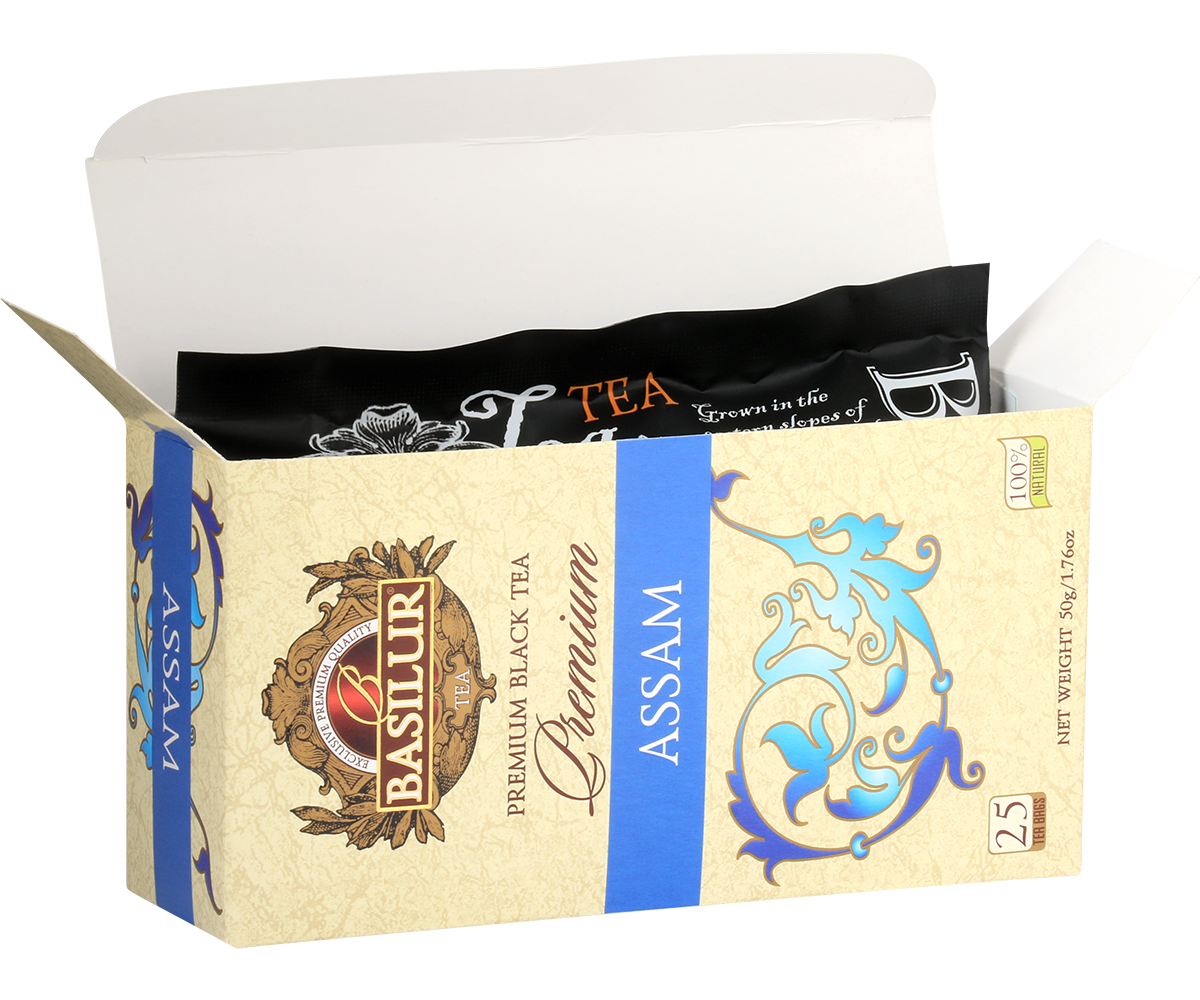 Otwarta herbata Basilur Premium Assam z widocznymi zapakowanymi torebkami.