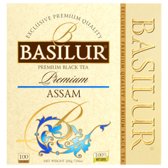 Front pudełka Basilur Assam z logo i złoto-niebieskimi zdobieniami