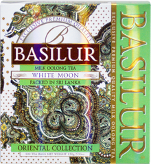 Herbata Basilur White Moon – mleczna herbata oolong w eleganckim zielono-złotym opakowaniu.
