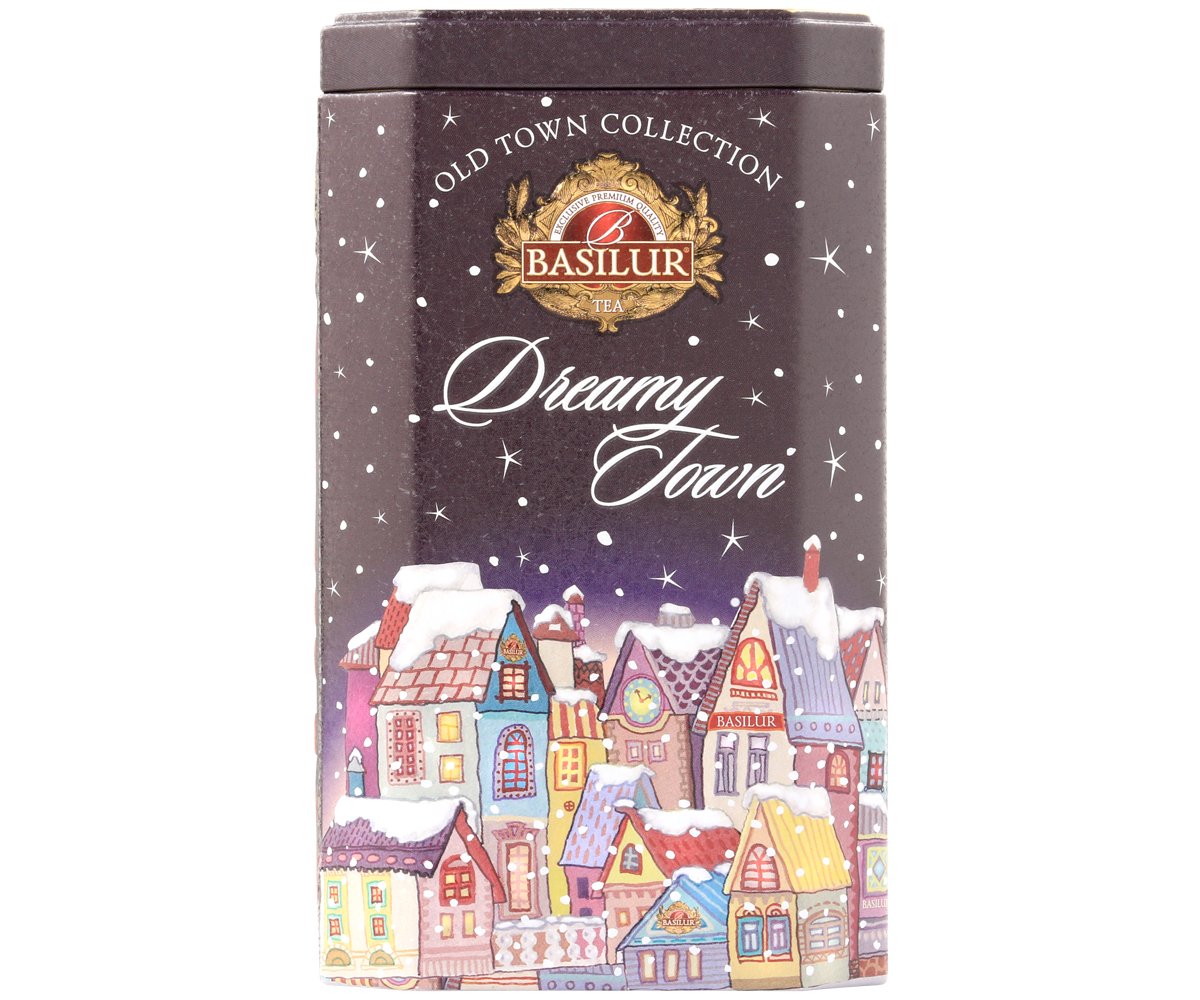 Zbliżenie na opakowanie herbaty Basilur Dreamy Town z kolorową ilustracją domków pod śniegiem.