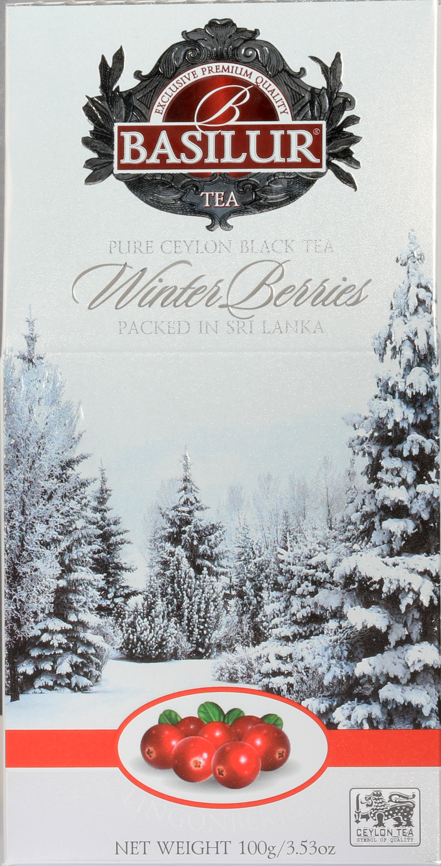 Front pudełka herbaty Basilur Lingonberries z logo i grafiką zimowego lasu.