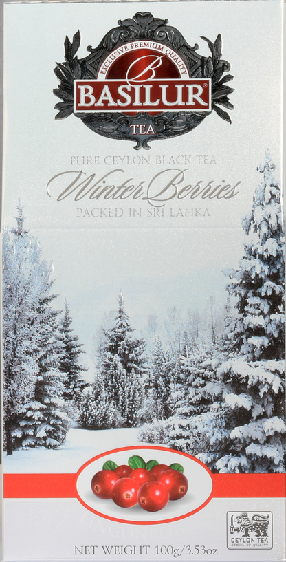 Front pudełka herbaty Basilur Lingonberries z logo i grafiką zimowego lasu.