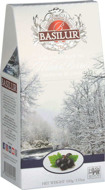Opakowanie herbaty Basilur Blackcurrant 100 g z motywem ośnieżonych drzew i owoców porzeczki.