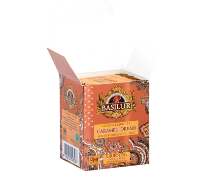 Otwarta paczka Basilur Caramel Dream z widocznymi kopertami herbaty czarnej