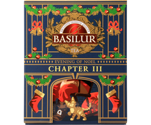 Herbata Basilur Chapter III Evening of Noel w ozdobnej świątecznej puszce z motywem kota i kominka.