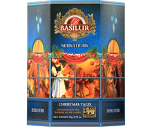 Herbata Basilur Christmas Tales w niebieskiej świątecznej puszce z ilustracją bożonarodzeniowej sceny.