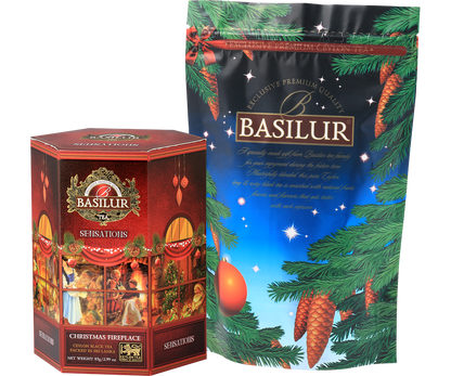 Zestaw Basilur Christmas Fireplace w ozdobnym opakowaniu z motywem choinki i torebką foliową.