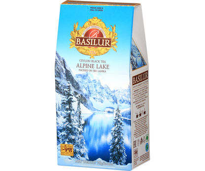 Opakowanie Basilur Alpine Lake z widokiem na zimowy krajobraz i złote logo marki.