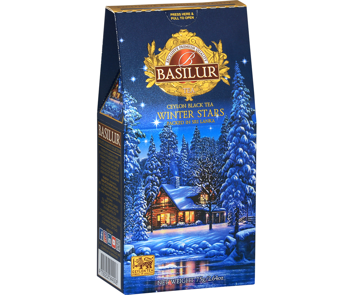Opakowanie herbaty Basilur Winter Stars z zimowym pejzażem i chatką w lesie, herbata czarna cejlońska.