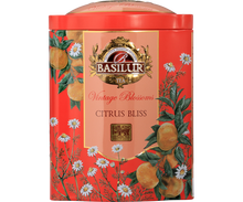 Przód ozdobnej puszki Basilur Citrus Bliss z motywem pomarańczy i kwiatów.