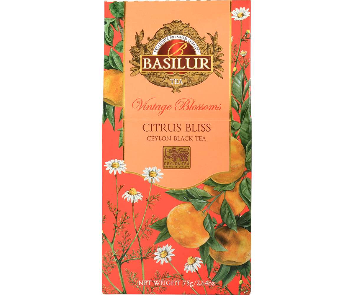 Herbata Basilur Citrus Bliss z kolekcji Vintage Blossoms w ozdobnym pomarańczowym opakowaniu z motywem cytrusów i rumianku.