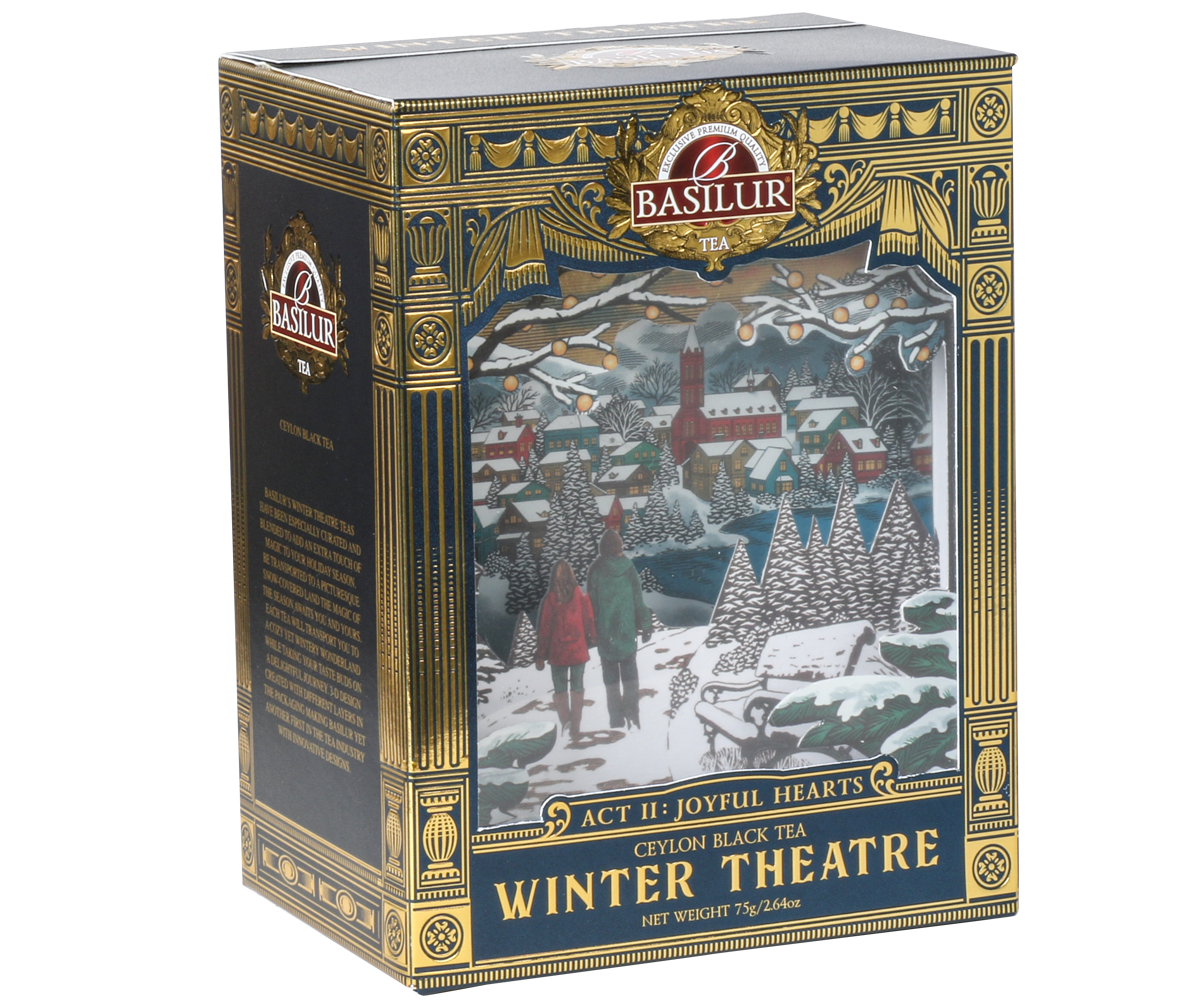 Opakowanie herbaty Basilur Act II: Joyful Hearts 75 g z motywem zimowego miasteczka i złotymi zdobieniami.