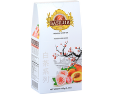 Opakowanie herbaty Basilur Peach Rose 100 g z motywem róż i brzoskwiń – elegancka biała herbata premium.