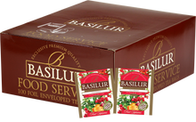 Opakowanie zbiorcze Basilur Cranberry z widocznymi saszetkami herbaty owocowej o smaku żurawiny.