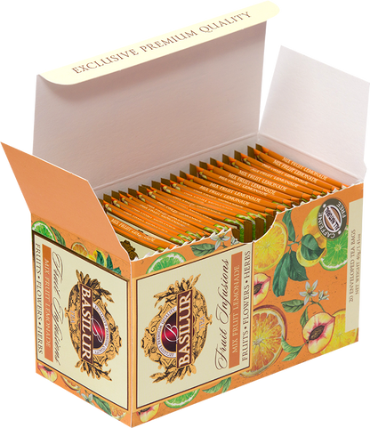 Otwarta herbata Basilur Mix Fruit Lemonade z widocznymi pomarańczowymi kopertkami.