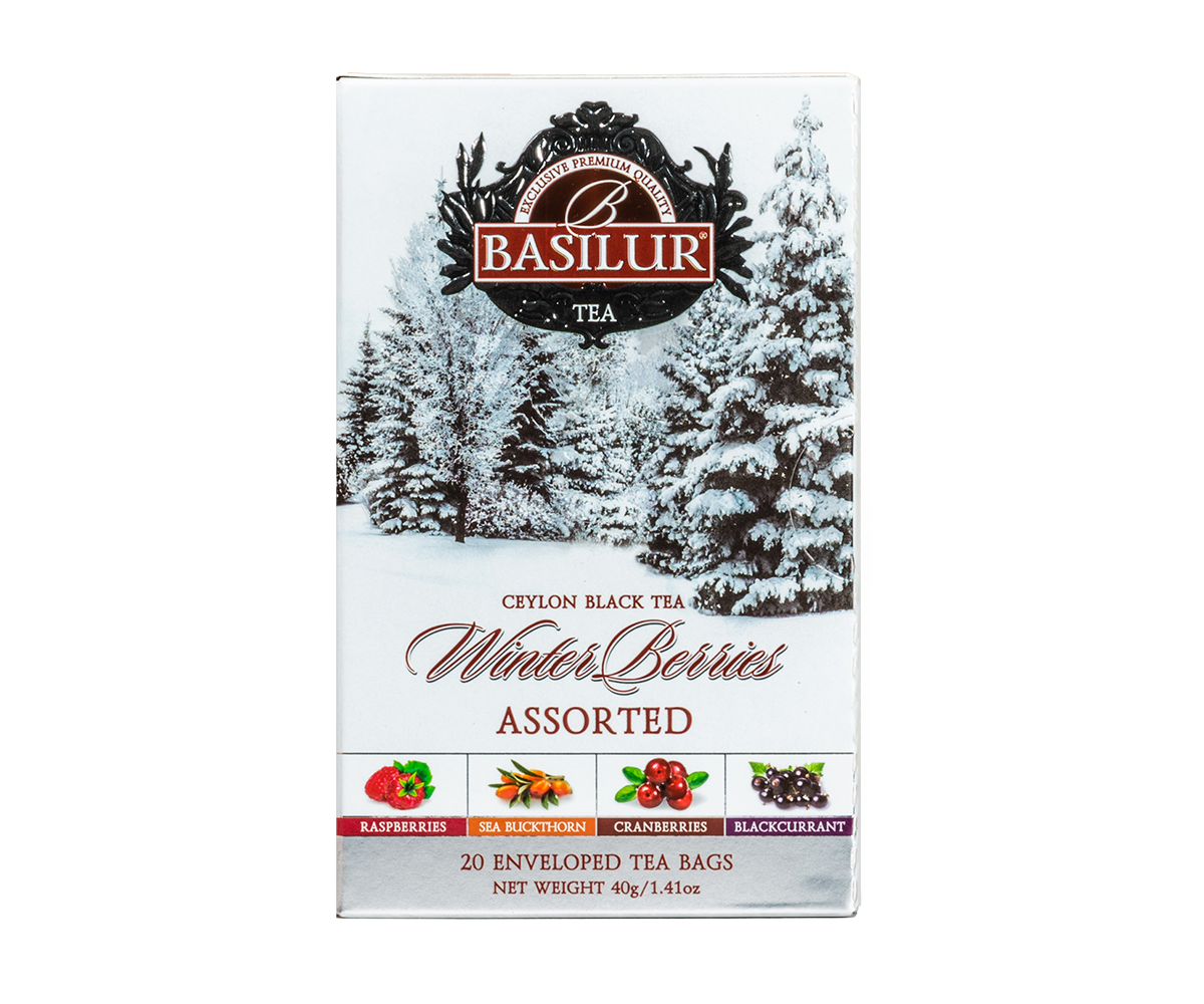 Herbata Basilur Winter Berries w zimowym opakowaniu z ilustracją ośnieżonych drzew.