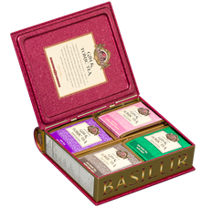 Otwarty zestaw Basilur Gin & Tonic Tea z czterema rodzajami herbat w kolorowym wnętrzu.