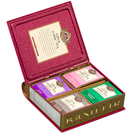 Otwarty zestaw Basilur Gin & Tonic Tea z czterema rodzajami herbat w kolorowym wnętrzu.