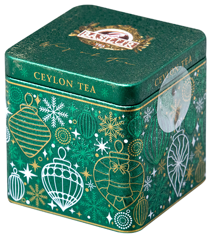 Zielona puszka świąteczna Basilur Gift of Joy z motywem bombek i płatków śniegu.