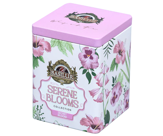 Elegancka puszka Basilur Secret Bloom ozdobiona różowymi kwiatami z widoczną etykietą.
