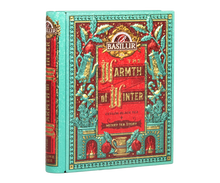 Puszka Basilur Warmth of Winter vol. I w formie książki z bogatym świątecznym motywem.