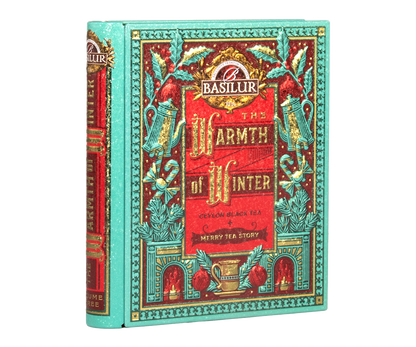 Puszka Basilur Warmth of Winter vol. I w formie książki z bogatym świątecznym motywem.