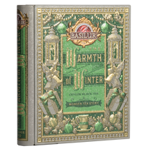 Puszka Basilur Wonder Tea Story w kształcie książki z zielono-złotym zdobieniem.