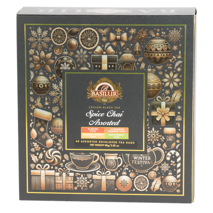 Przód pudełka Basilur Spice Chai Assorted z motywem zimowych ozdób i logo Basilur.