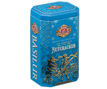 Bok puszki Basilur The Legend of the Nutcracker z opisem herbaty i zimowym wzorem płatków śniegu.