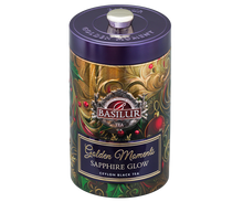 Herbata Basilur Golden Moments Sapphire Glow w metalowej puszce z fioletową pokrywką.