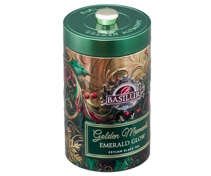 Zdobione opakowanie Basilur Golden Moments Emerald Glow z bożonarodzeniowym motywem.