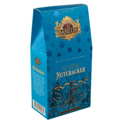 Niebieskie opakowanie herbaty Basilur z ilustracją dziadka do orzechów na tle zimowego krajobrazu