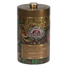 Puszka Basilur Golden Moments Amber Glow w złotym kolorze z eleganckim świątecznym zdobieniem.