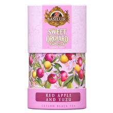 Herbata czarna Basilur Red Apple And Yuzu w dekoracyjnej tubie, widok opakowania z przodu.