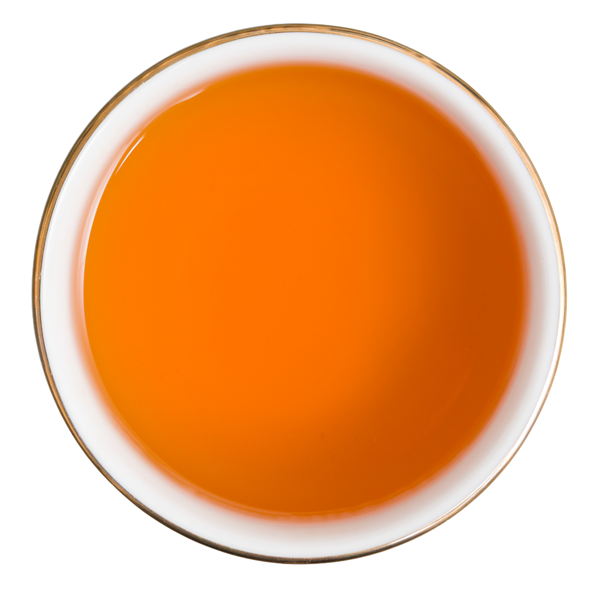 Bursztynowo-pomarańczowy napar czarnej herbaty Basilur Orange and Orange Blossom widziany z góry.