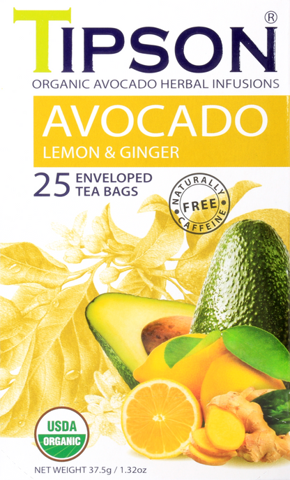 Zbliżenie opakowania herbaty Tipson Avocado Lemon & Ginger z owocami cytryny i kawałkami imbiru.