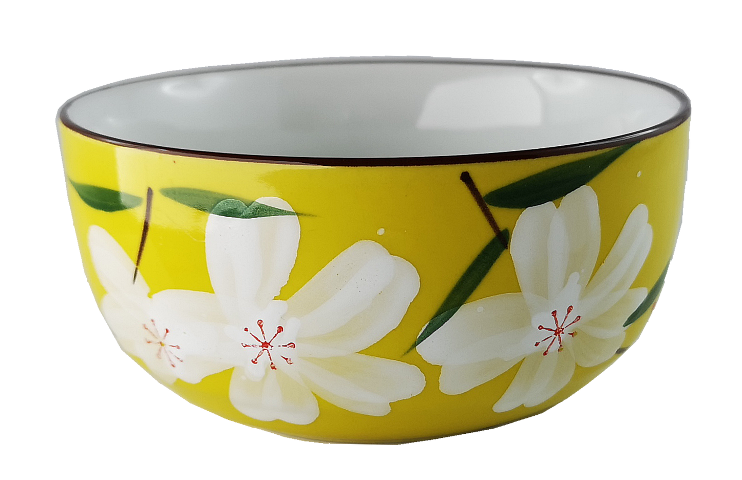 Ceramiczna czarka do herbaty w żółtym kolorze, zdobiona białymi kwiatami i zielonymi liśćmi.