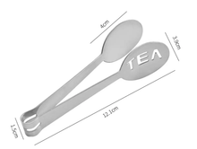 Metalowe szczypce do herbaty z wymiarami 12,1 cm długości – ilustracja techniczna.
