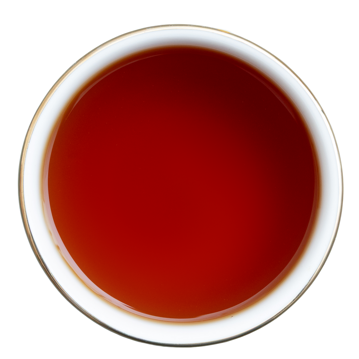 Filiżanka czarnej herbaty Earl Grey o intensywnej bursztynowoczerwonej barwie, widok z góry.