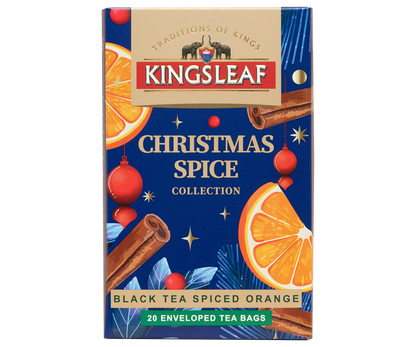 Herbata Kingsleaf Black Tea Spiced Orange w świątecznym granatowym opakowaniu z pomarańczą i cynamonem.